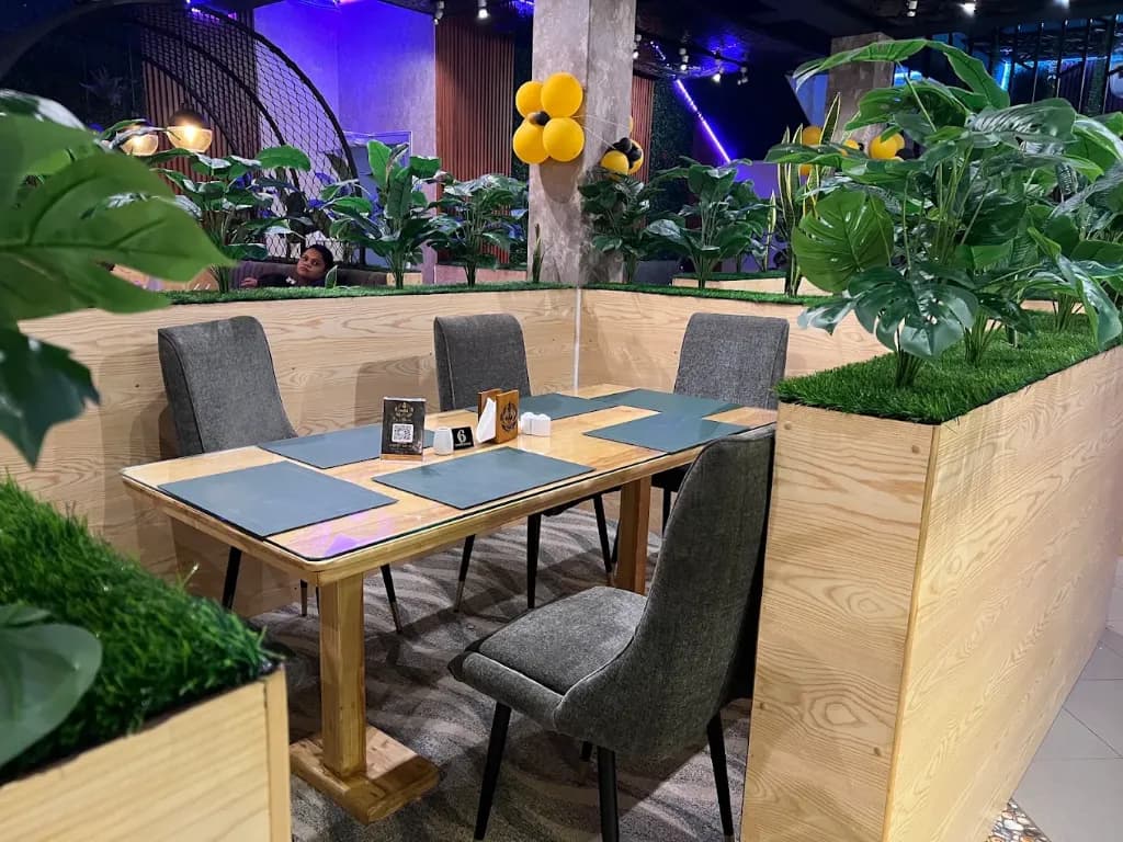 Kathir Indoor Botanical Dining Booths with Lush Natural Plants